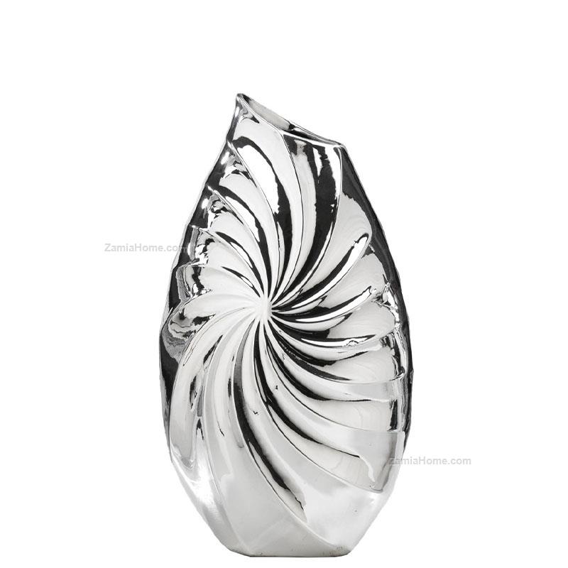 Silver coated vase waves