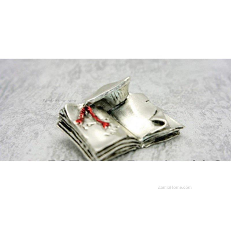 Graduation hat on book